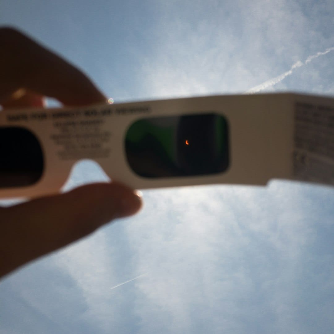 Photo by Jason Howell person's hand holding white 3D sunglasses